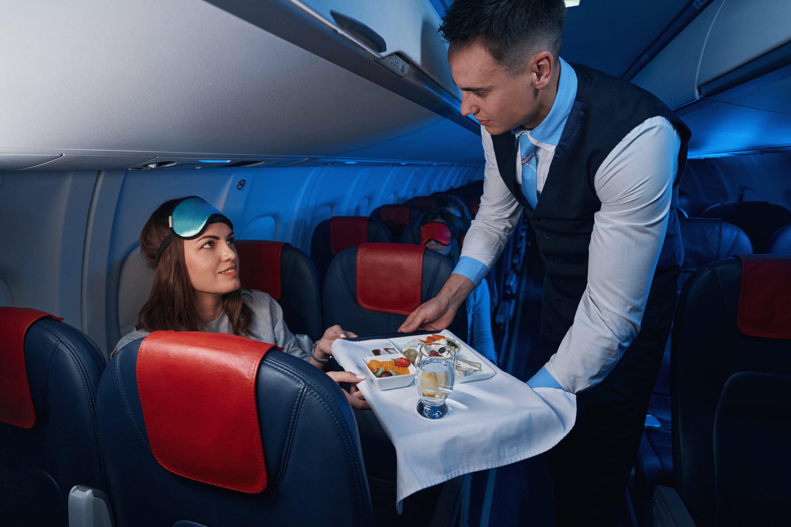 A flight attendant serving with sustainable products